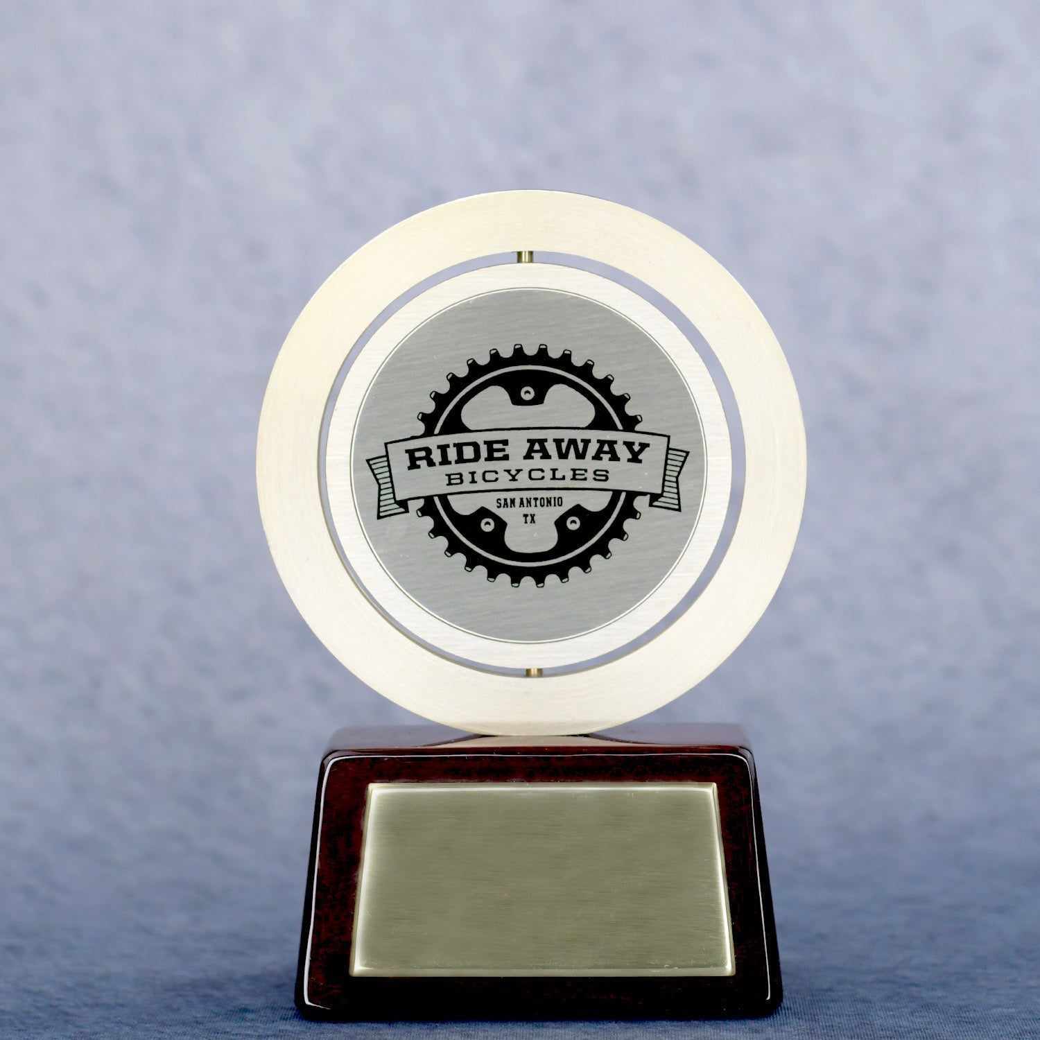 Gold Spinning Medal On Rosewood Base
