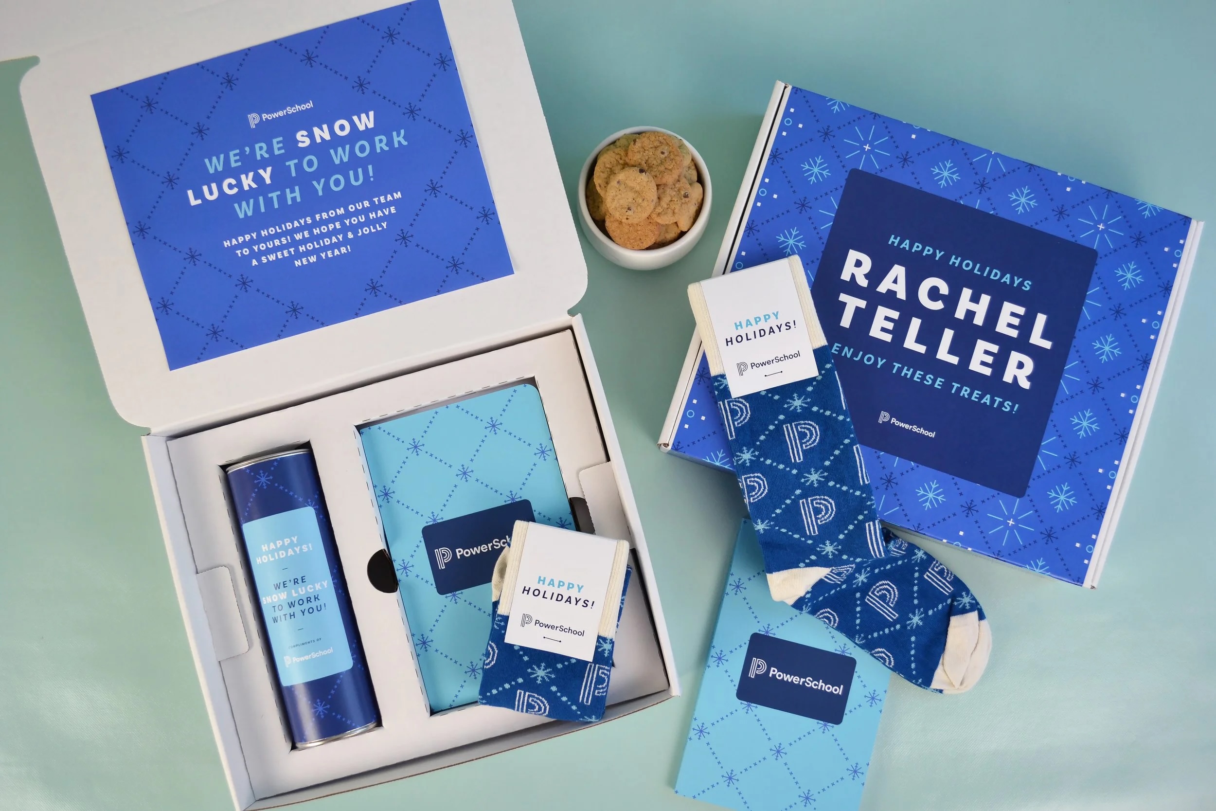 Gift box kit with socks, a can of cookies and a notebook