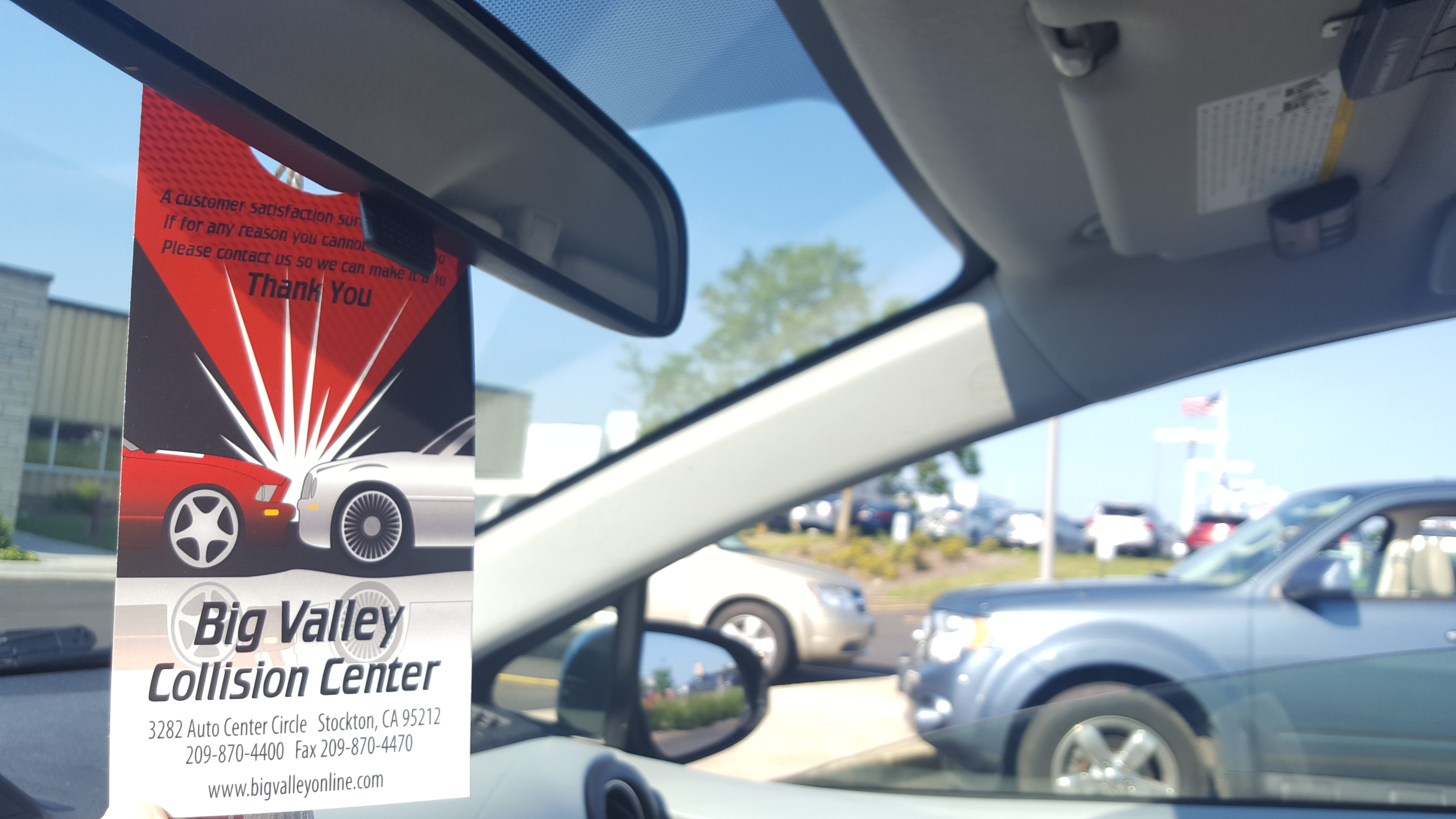 Rear view mirror hanger for auto dealerships and repair shops